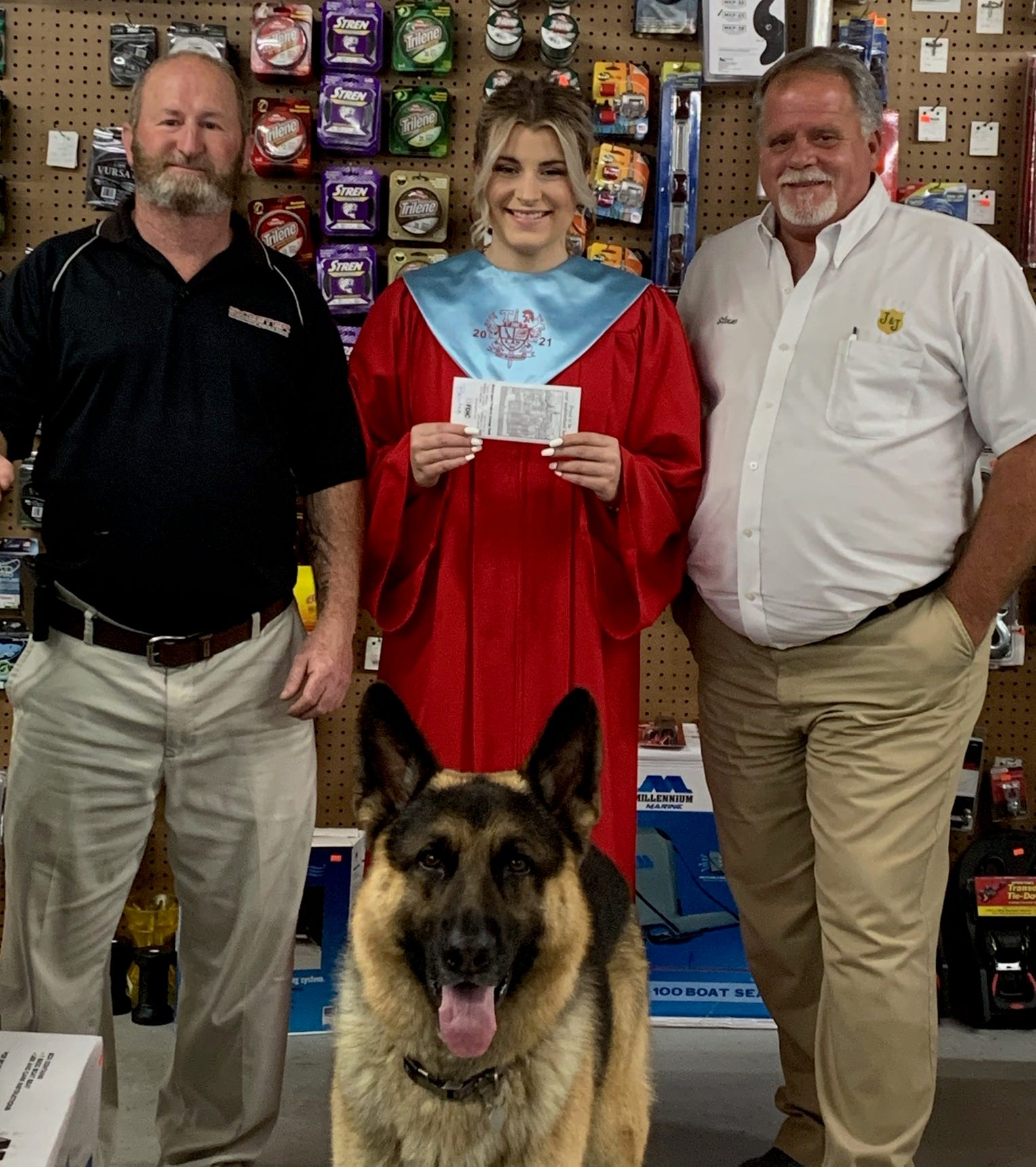 Pictured left to right, Jimmie Box – President, Bella Brister, Steve Burks – Vice President, and Gunny the German Shepherd